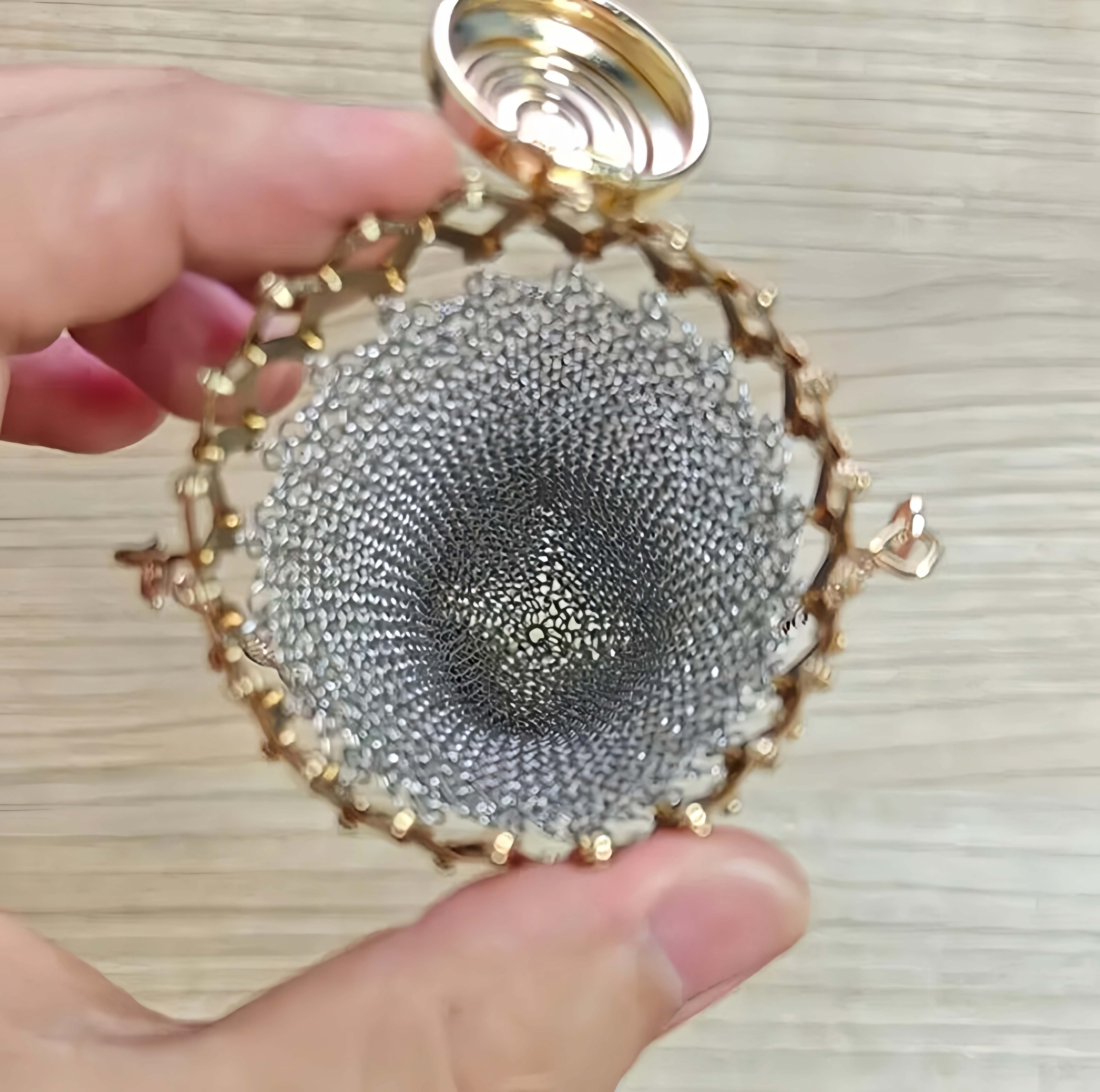 Open hinged lid on vintage mesh coin purse