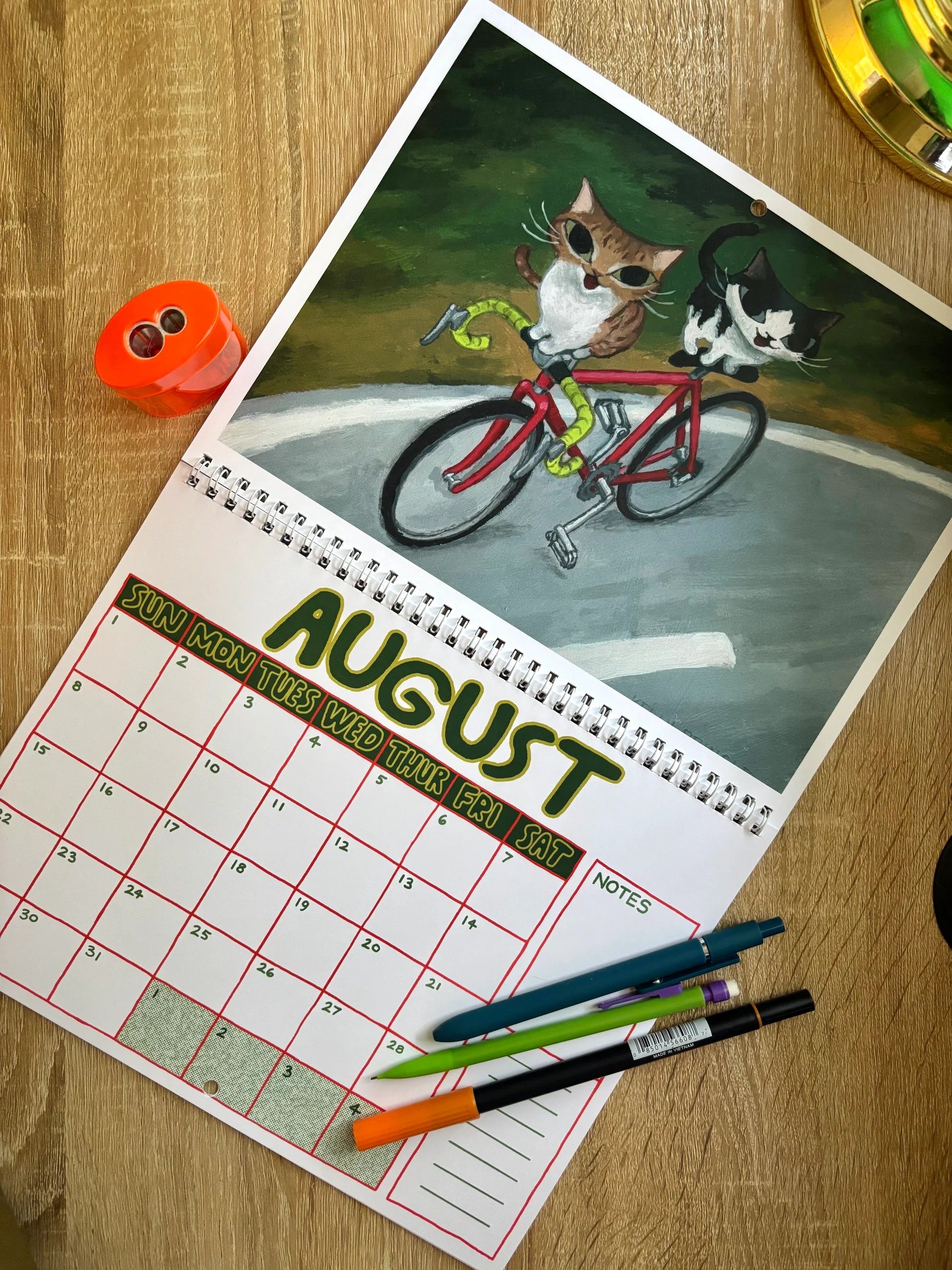 Whimsical illustrated cat calendar artwork