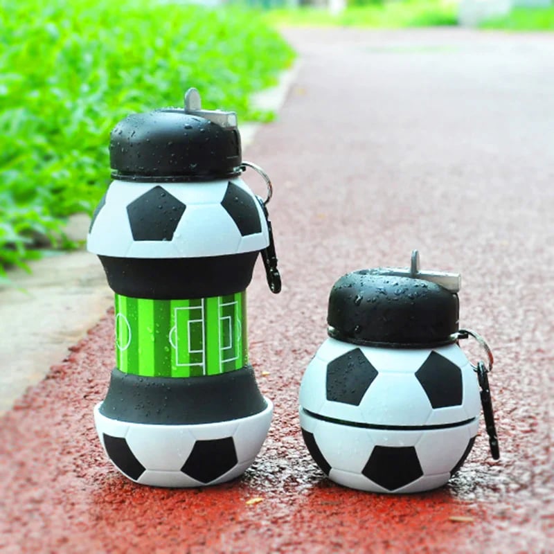 Foldable soccer ball water bottle on outdoor path
