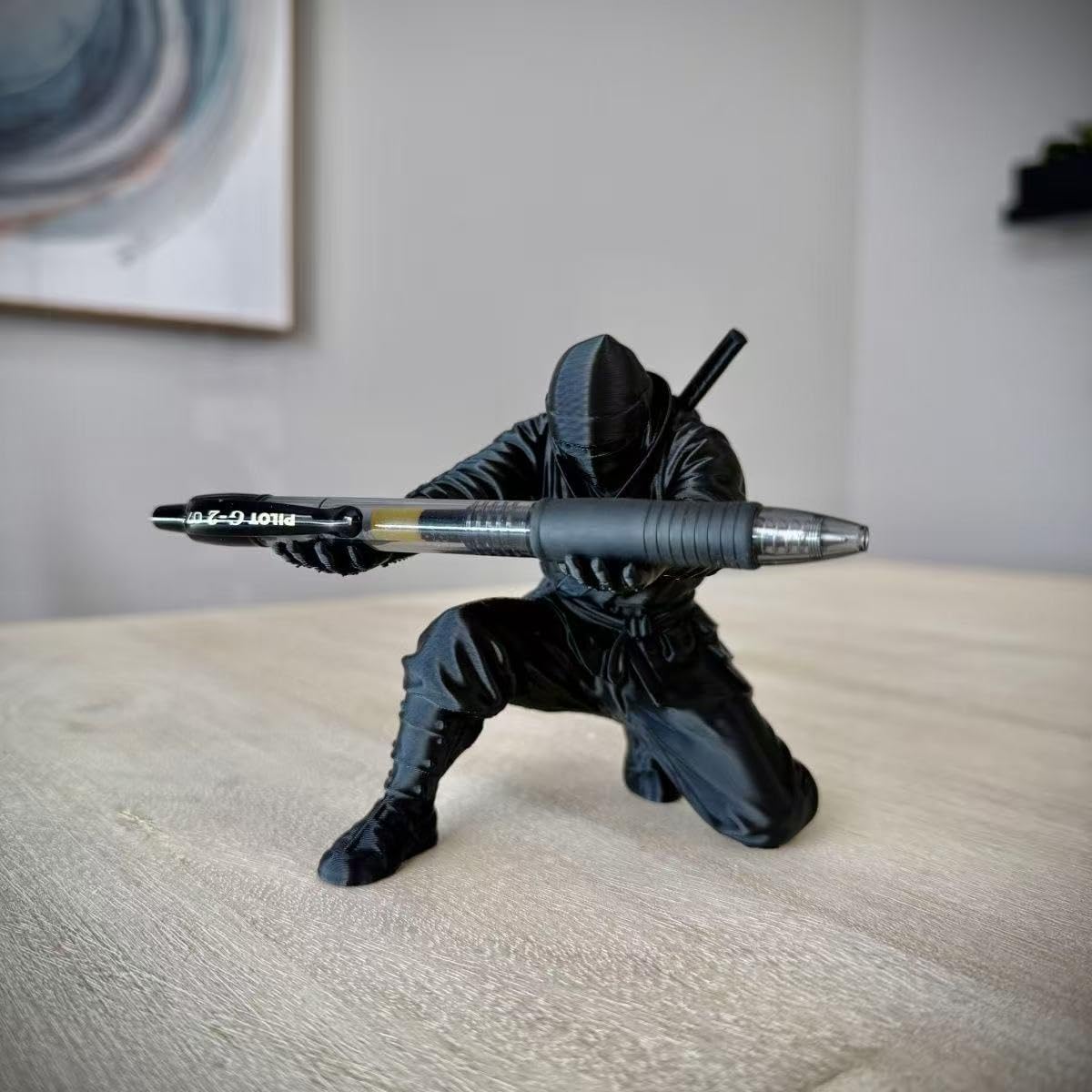 Front close up view of the black ninja figurine pen stand