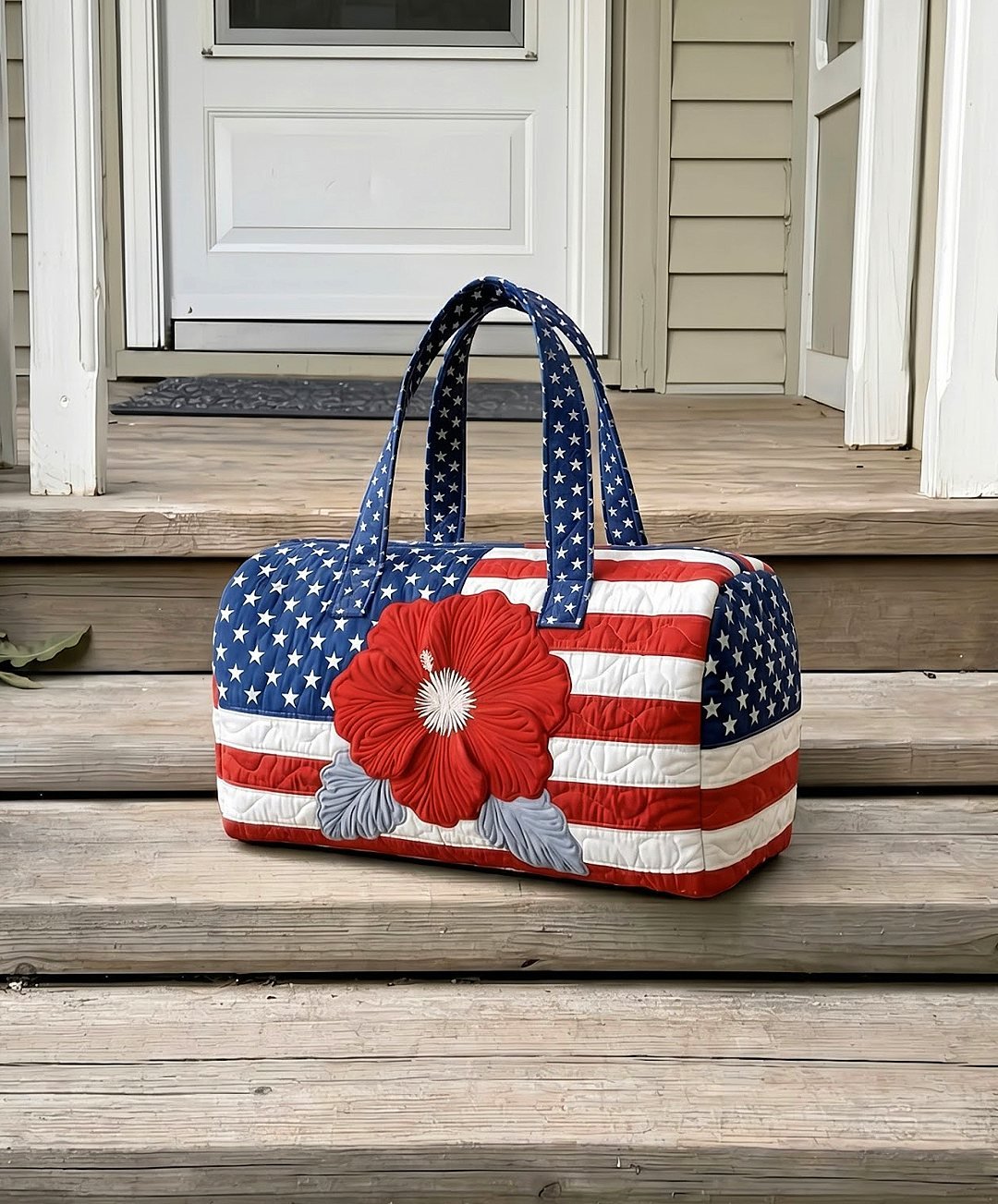 Woman holding the quilted tote bag in a mirror