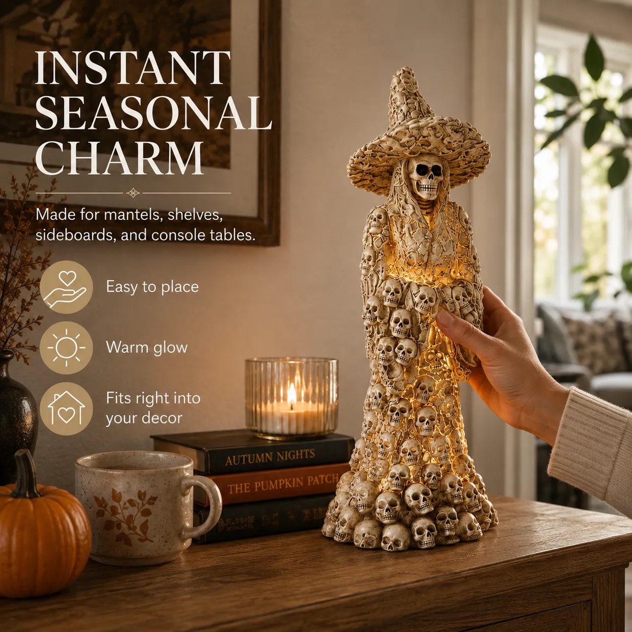 Glowing witch statue displayed with fall decorations