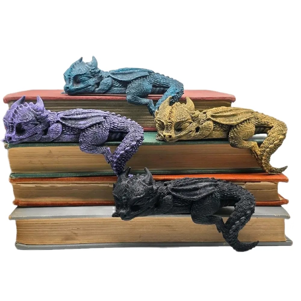 Sleeping bookshelf dragons in multiple colors perched on stacked books