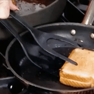Silicone grip flip tongs used with cookware
