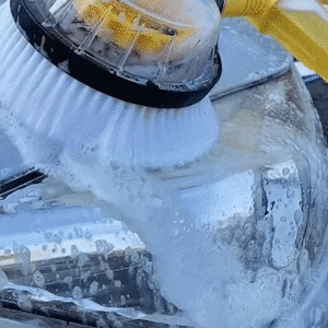 Auto rotating car wash brush
