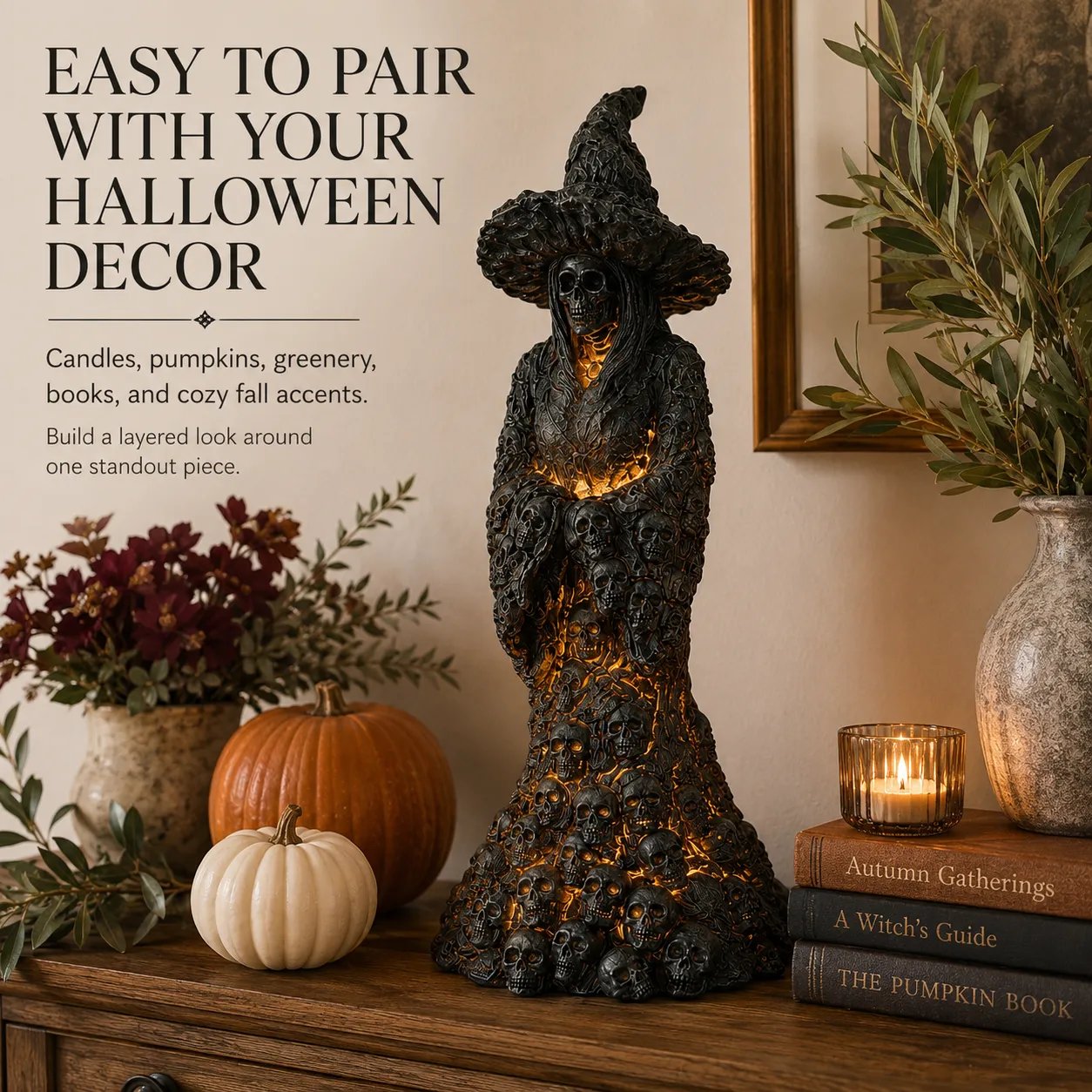 Skull Witch Lantern Statue paired with pumpkins and candles