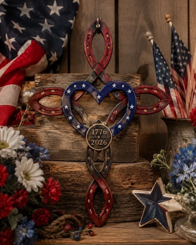 patriotic America 250th cross displayed with red white blue flowers and flags